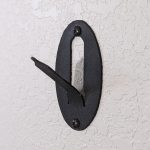 Easy European mount skull hanger. A black oval with a bent hook to hang a deer skull on.